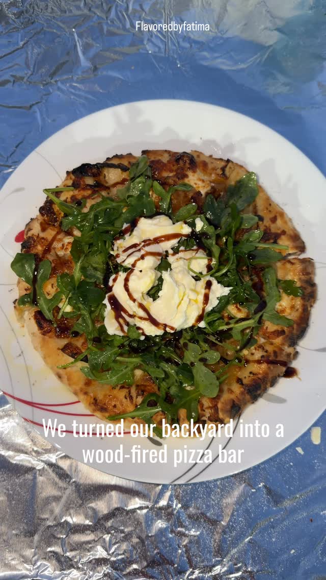 Pizza night at our house is never just pizza night. 🍕✨  The Ooni comes out, everyone claims their favorite toppings, and somehow a simple dinner turns into a full-blown backyard pizza bar.  This time we made classic cheese, margherita, wild mushroom, and my personal favorite—goat cheese, fig spread, caramelized onions, fresh arugula, burrata, and a drizzle of balsamic glaze.  Somewhere in Italy, a nonna is shaking her head at this Pakistani family putting burrata, fig spread, and chili flakes on Neapolitan pizza... but she’d probably ask for a second slice. 😆  And because so many of you always ask for the dough recipe, here’s the Neapolitan-style dough we used:  🍕 Neapolitan Pizza Dough  1000g flour (00 flour or bread flour)700g water20g salt7g instant yeast  Mix flour, water, and yeast until combined.  Rest 15-20 minutes.  Add salt and knead until smooth.  Let rise for 2 hours.  Divide into 8 dough balls (about 210-220g each).  Let dough balls rest 1½-2 hours until puffy.  Stretch, top, and bake in a hot Ooni oven until beautifully blistered.  Simple ingredients. Great company. Fresh dough. And a few pizzas that disappeared before I could photograph them. 😅  What would be on your dream pizza?  #chicagofoodie #flavoredbyfatima #oonipizzaoven #woodfiredpizza #neopolitanpizza