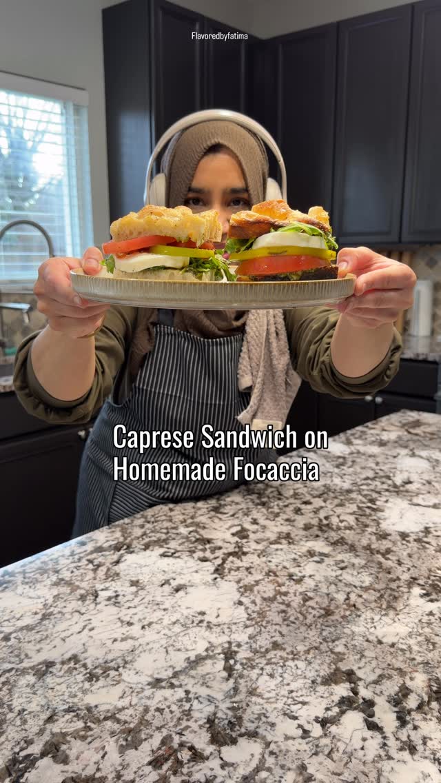 Let’s make lunch together 🤍
This caprese sandwich on fresh homemade sourdough focaccia is honestly better than most cafés—simple, fresh, and everything you want in one bite.  Save this for later and don’t forget to tag me when you make it.  ⸻  Sourdough Focaccia (1 Loaf – 9x13 pan)  Ingredients:  500g all-purpose or bread flour
375g water (room temp)
100g active sourdough starter (bubbly & fed)
10g salt
3 tbsp olive oil (plus more for pan + topping)  Instructions:  In a bowl, mix water and starter until milky. Add flour and mix until combined. Let it rest for 20–30 minutes (autolyse).  Add salt and 1 tbsp olive oil. Mix well until smooth. Cover and let it rest.  Over the next 2 hours, do 3–4 stretch and folds every 30 minutes.  Cover and let the dough rise at room temp for 4–6 hours until puffy and doubled (or refrigerate overnight for deeper flavor).  Generously oil a 9x13 pan. Transfer dough gently into the pan. Let it rest again for 1–2 hours until it spreads and becomes airy.  Preheat oven to 425°F. Drizzle olive oil over the dough and dimple with your fingers.  Bake for 20–25 minutes until golden brown. Cool slightly before slicing.  ⸻  Caprese Focaccia Sandwich  Ingredients:  Fresh focaccia bread
Heirloom tomatoes, sliced
Fresh mozzarella, sliced
Arugula
Pesto
Balsamic glaze
Olive oil
Salt & pepper  Instructions:  Slice tomatoes and season with salt and pepper. Let them sit for a few minutes to release their juices.  Slice focaccia in half and spread a generous layer of pesto.  Layer tomatoes, then mozzarella slices.  In a bowl, toss arugula with olive oil, salt, and pepper. Add on top.  Drizzle balsamic glaze and a little more olive oil.  Close the sandwich, press gently, slice, and enjoy.  #homemadebread #caprese #flavoredbyfatima #chicagofoodie #lunchideas
